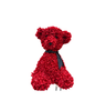 Ours en fleurs rouge assis